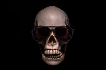Skull in sunglasses on a black background