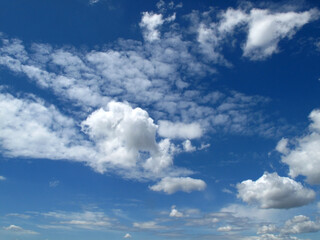 Beautiful, white, fluffy summer clouds on a blue sky