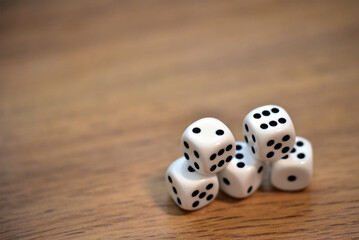dice on wooden table 