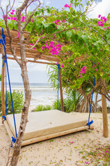 Hammock on the beach on low tide. Sun bed in tourist resort. Tropical resort. Summer relaxation....