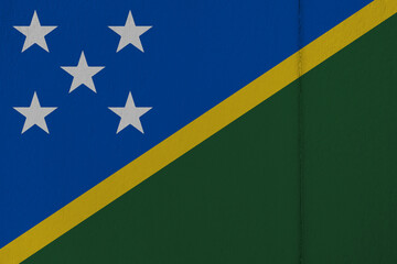 Patriotic wooden background in colors of national flag. Solomon Islands