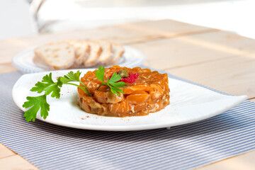 Salmon tartare with caper caviar and decorative parsley