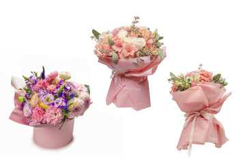 Pink and purple bouquet of flowers in a pink box isolated on white.