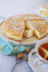 Italian cuisine. Ricotta (cottage cheese) grated tart and cup of tea
