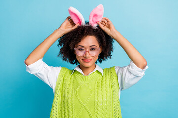 Photo of adorable sweet positive childish playful lady wear bunny ears celebrate easter isolated on...