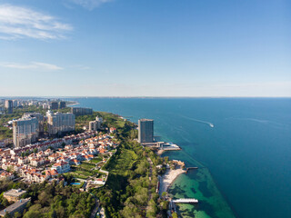 Beautiful panoramic aerial view of the sea city Odessa and Arcadia beach on a sunny spring day. Seascape and urban development on the seashore. Travel in Ukraine.