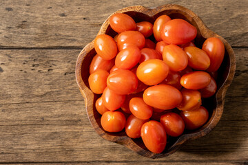 fresh homemade cherry tomatoes on a wooden table