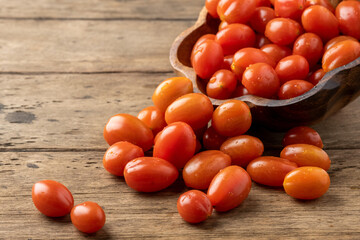 Fototapeta na wymiar fresh homemade cherry tomatoes on a wooden table