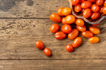 Fototapeta na wymiar fresh homemade cherry tomatoes on a wooden table