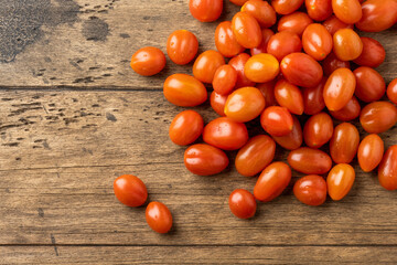 fresh homemade cherry tomatoes on a wooden table