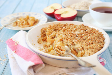 Apple crumble from oatmeal and cup of tea for healthy breakfast