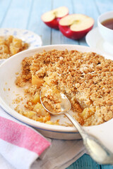 Apple crumble from oatmeal and cup of tea for healthy breakfast