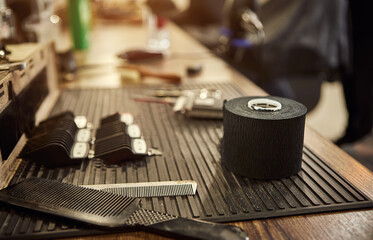Barber shops tools. Accessories for cutting on the table in a barbershop. Comb, brush, scissors, clipper and nozzles.