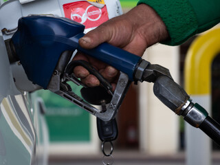 gas pump nozzles at gas station