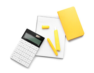 Calculator, notebooks and marker on white background