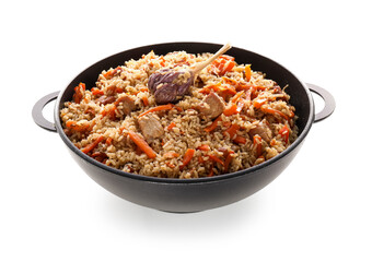 Frying pan with tasty Asian pilaf on white background