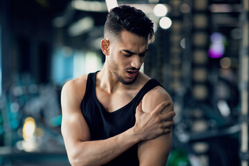 Arab Man With Shoulder Pain Suffering Sport Injury During Training At Gym