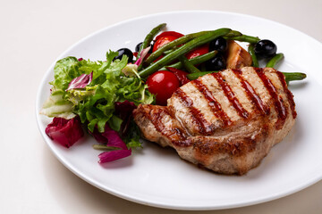 BBQ Steak. Barbecue Grilled Beef Steak Meat with Vegetables. Healthy Food. Barbeque Steak Dinner