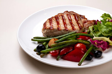 BBQ Steak. Barbecue Grilled Beef Steak Meat with Vegetables. Healthy Food. Barbeque Steak Dinner