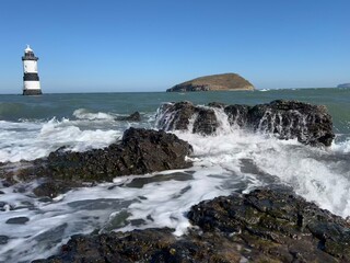 Penmon Point lighthouse on the coast