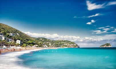 the bay of spotorno with its beaches of fine sand and the crystal clear sea in August, in western...