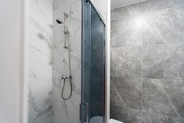 Modern bathroom with grey tiles, seamless, luxurious interior background.