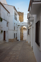 Narrow street in the old town of the famous white village of Setenil de las Bodegas, Cadiz province, Andalusia, Spain