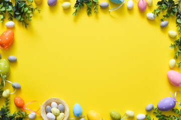 Naklejka na ściany i meble Colorful easter egg on yellow background, easter decoration