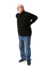 Fototapeta premium Senior man in eyeglasses suffering from back pain on white background