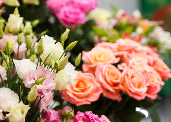 A beautiful bright bouquet of blooming fresh roses for a gift collected by an experienced florist