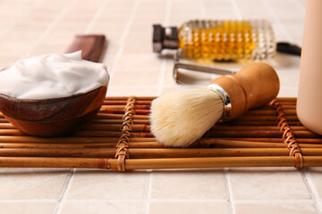 Fototapeta na wymiar Male accessories for shaving on tile background