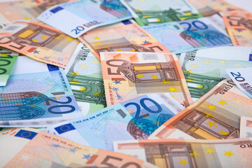 Obraz na płótnie Canvas Background of euro banknotes of different denominations