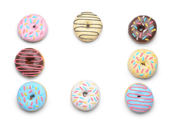 Frame made of delicious donuts on white background