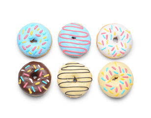 Different delicious donuts on white background