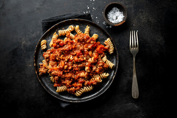 Pasta bolognese with vegetables on plate