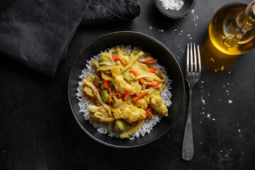 Tasty chicken fried with vegetables and rice