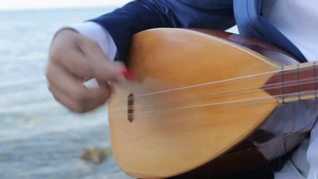 Saz Turkish instrument playing detail