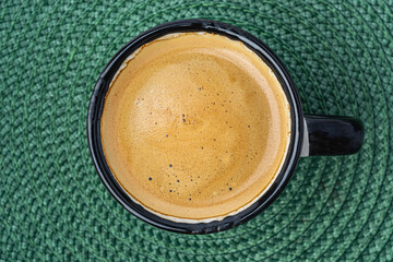 coffee espresso on a green background top view