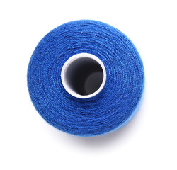 Blue thread spool on white background