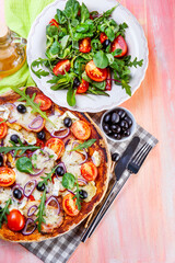 Pizza with arugula and olives