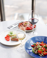 traditional wine appetizers. white and red wine. restaurant serving. summer mood. shallow depth of field