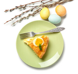 Plate with piece of tasty Easter tart, painted eggs and pussy willow branches on white background