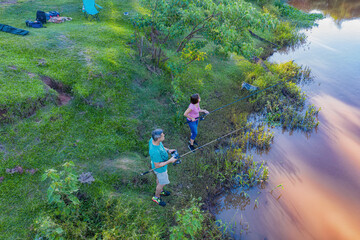 Obraz premium Aerial view of a man and woman fishing on the Tebicuary River in Paraguay.