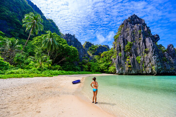 Girl at Hidden Beach in Matinloc Island, El Nido, Palawan, Philippines - Paradise lagoon and beach...