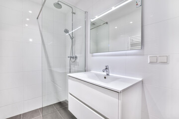 Modern bathroom with shower and sink in a minimalist apartment