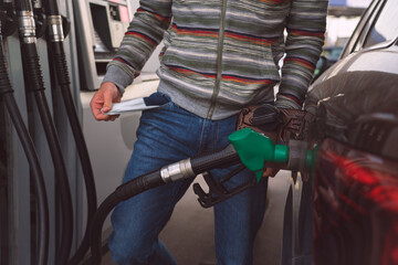 Man with empty pockets because of high petrol and fuel prices. Expensive gasoline