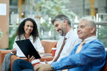 Business meeting at office with three business people.