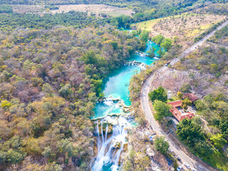 Fototapeta na wymiar Tamul Waterfall on Tampaon River, Huasteca Potosina, MexicoTamul Waterfall on Tampaon River, Huasteca Potosina, Mexico aerial drone view