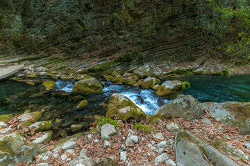 Naklejka na ściany i meble River with Waterfalls with clear water and rocks