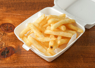 French fries in a takeout container